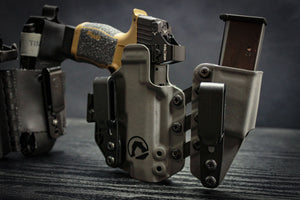 Sig Sauer P365XL with Holosun red dot securely holstered in a BlackArch Entrada IWB holster, featuring an attached spare magazine carrier.